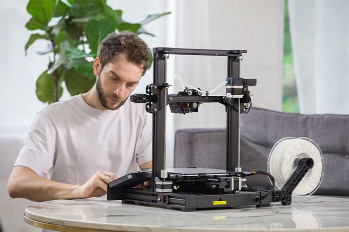 A man using a 3d printer